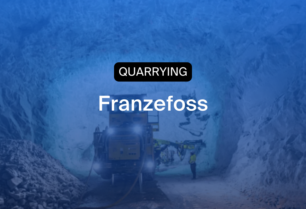 Quarry workers coordinating operations inside Franzefoss tunnel, showcasing workforce scheduling and heavy-duty logistics in mining.