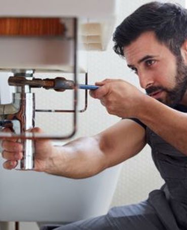 Employee in a housing association using a digital workforce management solution for scheduling, supporting efficient staffing, operational oversight and coordinated services across residential properties.