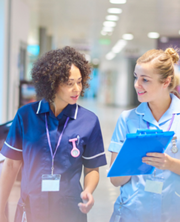 Frontline healthcare employees collaborating on scheduling and time tracking to improve workforce management and work-life balance