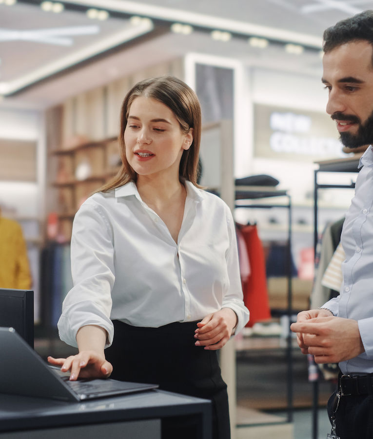 A diverse retail team brainstorming and strategizing together for a successful store project.